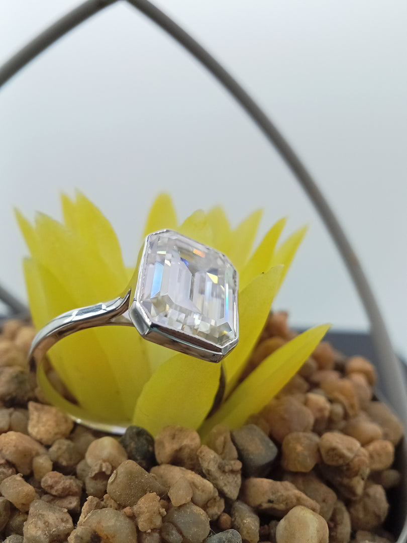 5.5 ct Emerald bezzel set engagement ring