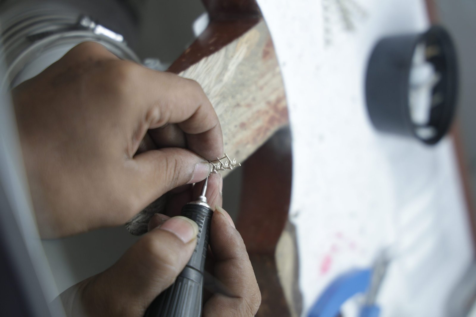 Hand filing the cast piece
